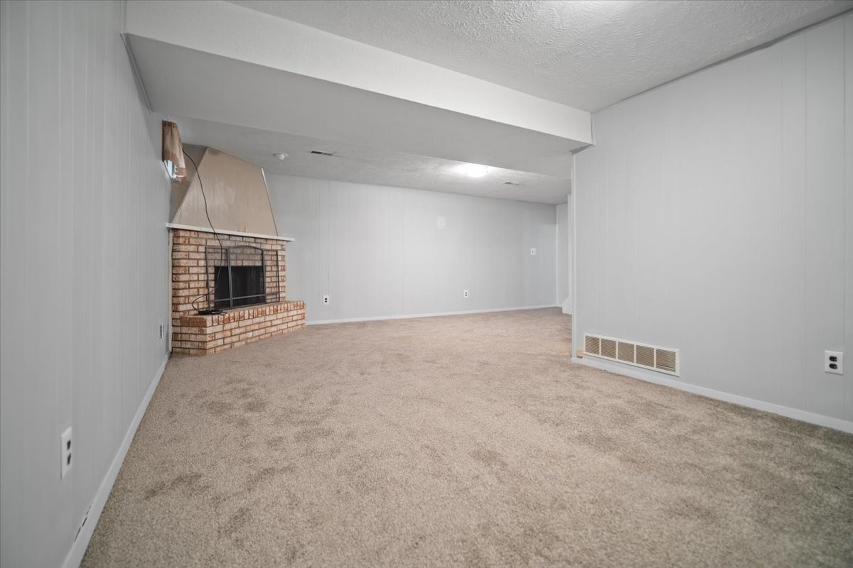 1707 King Drive, Unit D Normal, IL 61761 - Photo 17 of 24 an empty room with fireplace
