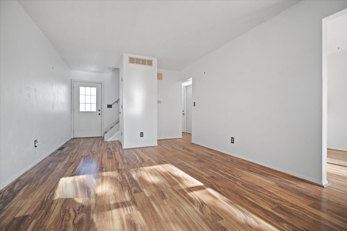 1707 King Drive, Unit D Normal, IL 61761 - Photo 6 of 24 a view of empty room with wooden floor