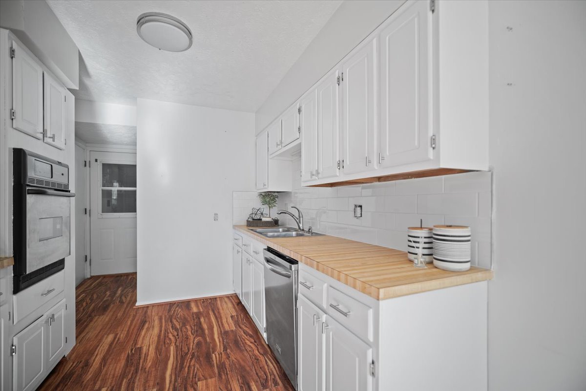1707 King Drive, Unit D Normal, IL 61761 - Photo 7 of 24 a kitchen with a sink and cabinets