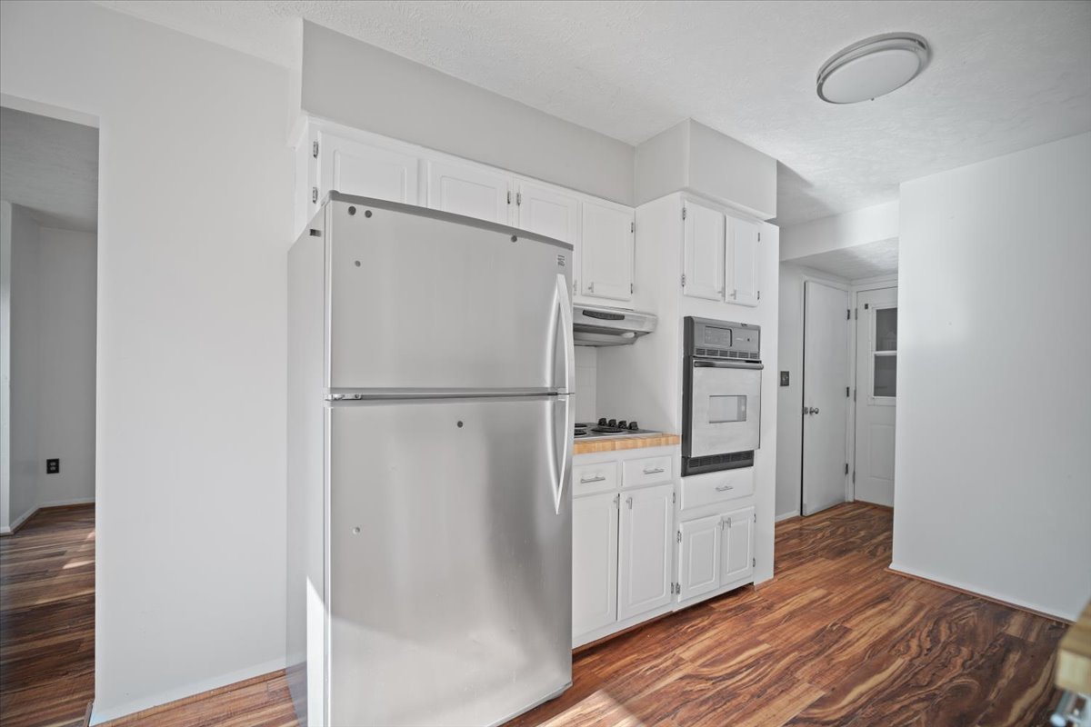 1707 King Drive, Unit D Normal, IL 61761 - Photo 8 of 24 a kitchen with stainless steel appliances a refrigerator and cabinets