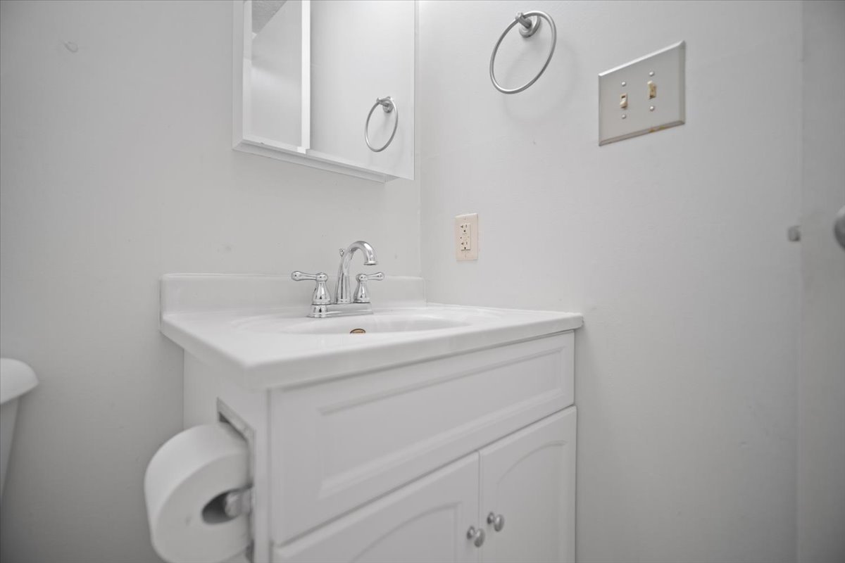 1707 King Drive, Unit D Normal, IL 61761 - Photo 10 of 24 a bathroom with a sink vanity and toilet