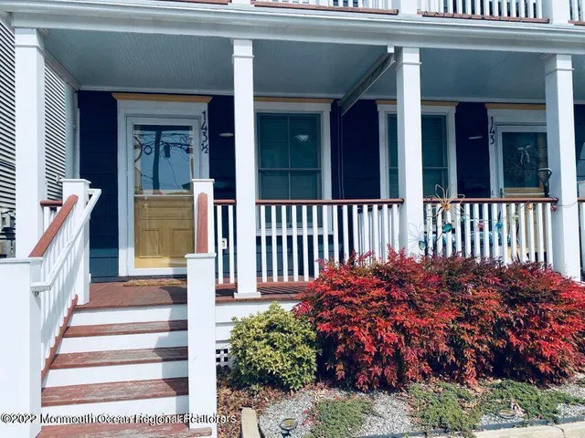 a view of a house with a flower garden