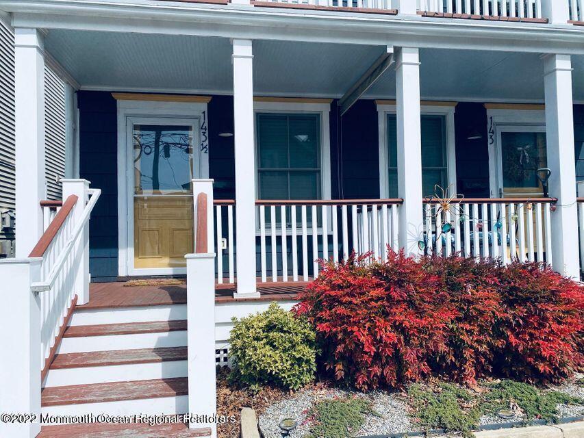143 Mt Hermon Way, Unit 1/2 Ocean Grove, NJ 07756 - Photo 2 of 26 a view of a house with a flower garden