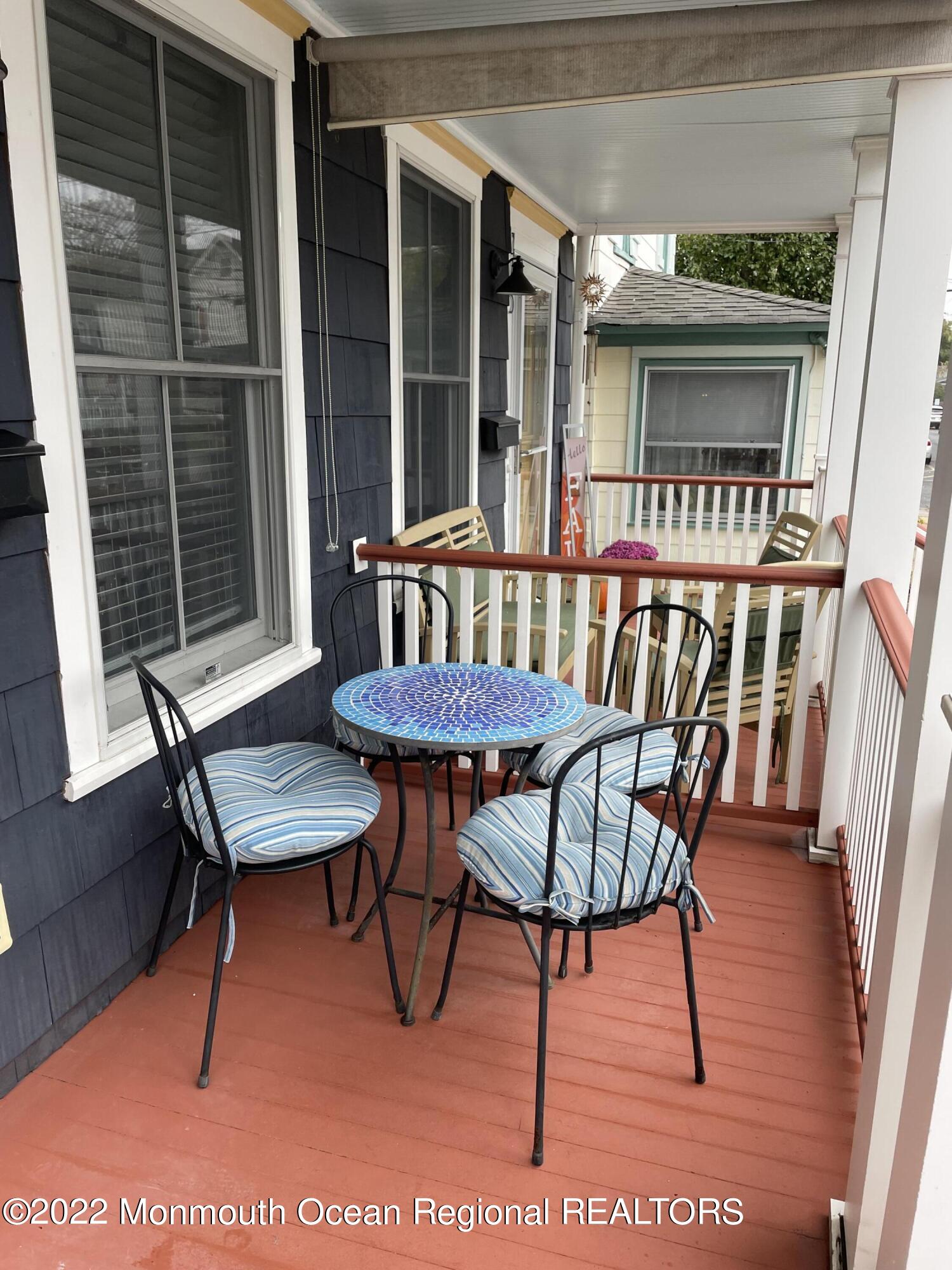 143 Mt Hermon Way, Unit 1/2 Ocean Grove, NJ 07756 - Photo 3 of 26 a view of a room with furniture window and wooden floor