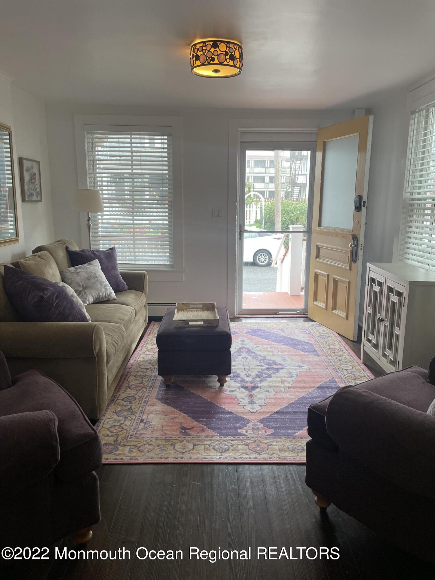 143 Mt Hermon Way, Unit 1/2 Ocean Grove, NJ 07756 - Photo 5 of 26 a living room with furniture and a window