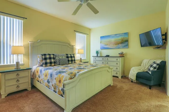 a bedroom with a bed and a couch