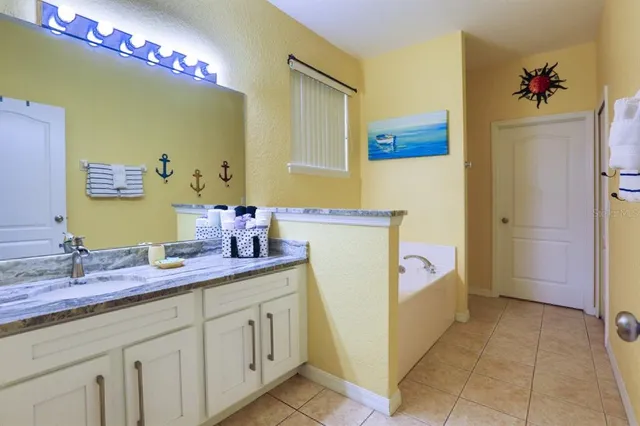 a bathroom with a sink double vanity and a mirror