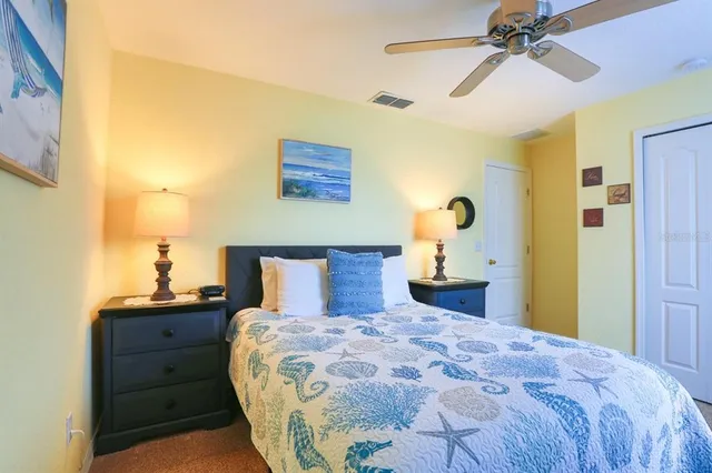 a bathroom with a granite countertop sink a toilet and a mirror