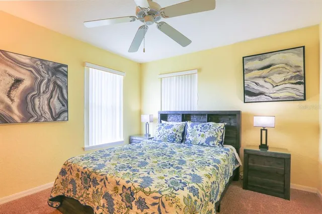 a bedroom with a bed and a chair