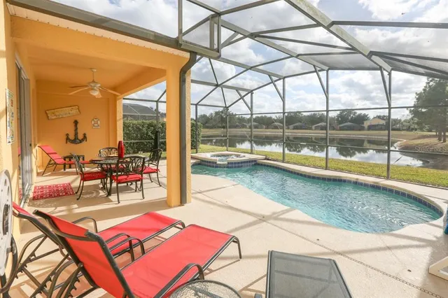 a view of a backyard with a patio and a yard