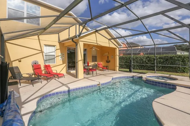 a view of a swimming pool with a patio
