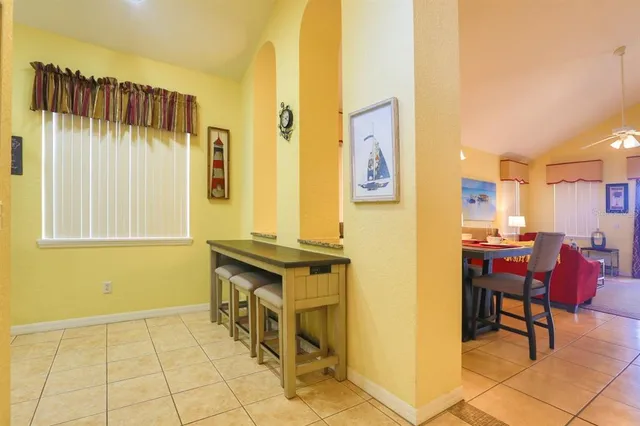 a kitchen with a cabinets and chairs