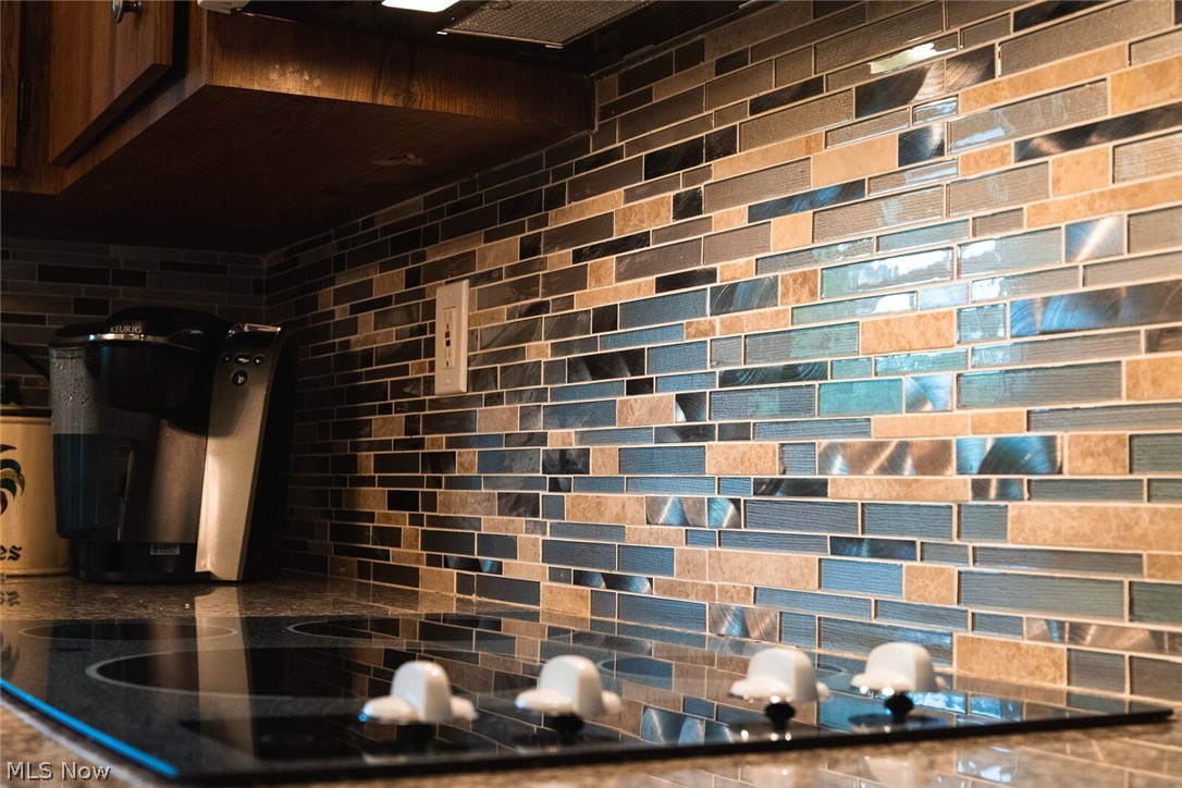 5004 Fairlawn Road Cleveland, OH 44124 - Photo 12 of 27 The new tile backsplash brings a bit of glam to the neutral kitchen.