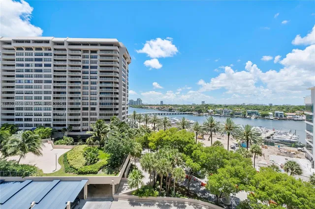 a view of a lake with a city skyline in the background