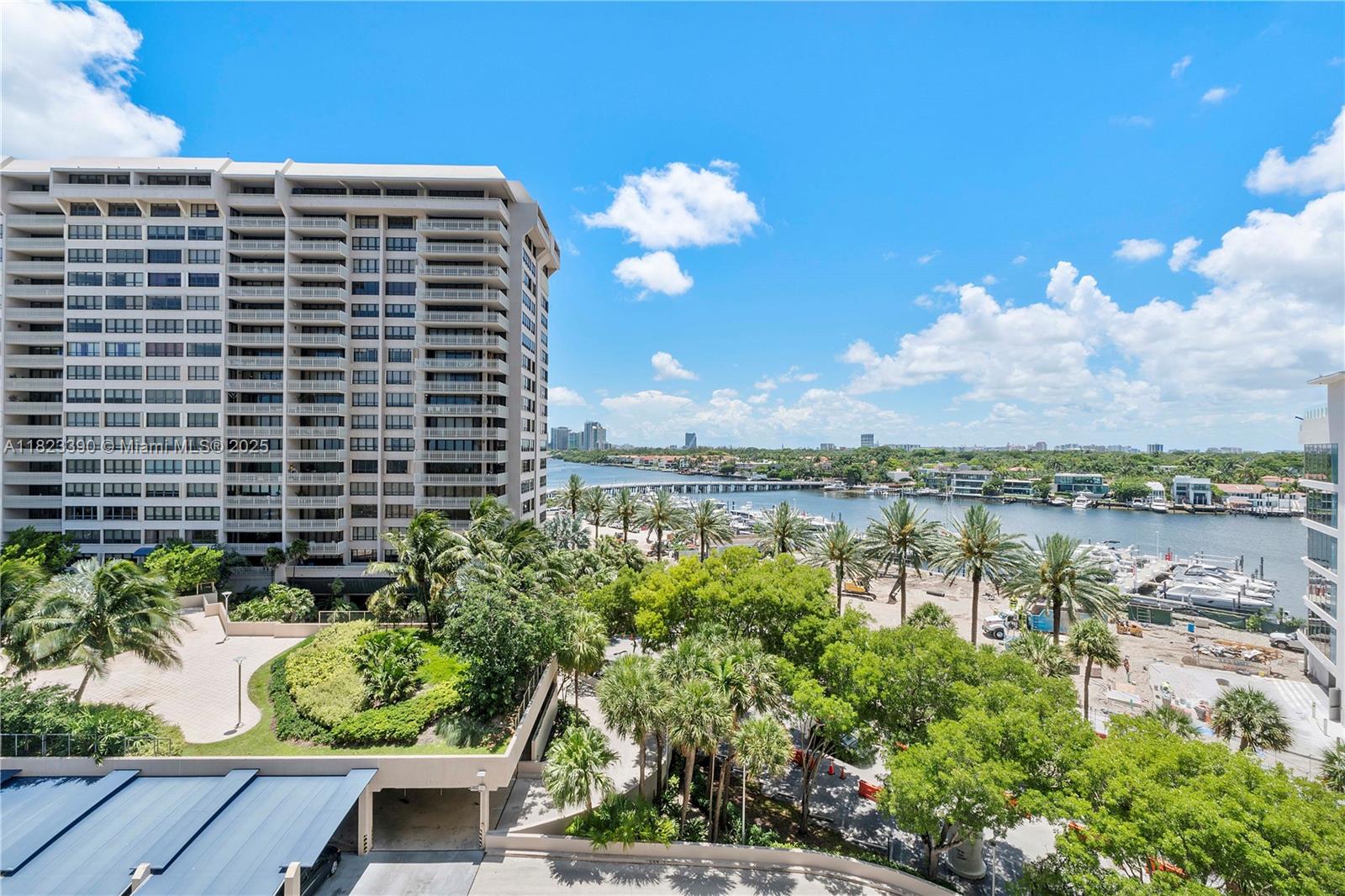 a view of a lake with a city skyline in the background