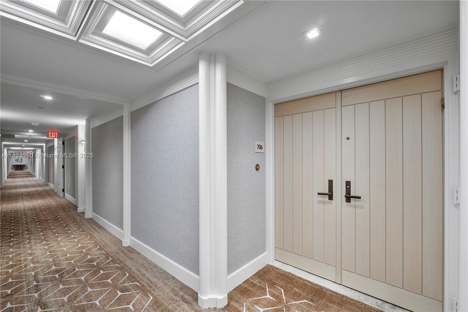 3 Grove Isle Drive, Unit C706 Miami, FL 33133 - Photo 12 of 20 a view of hallway with wooden floor