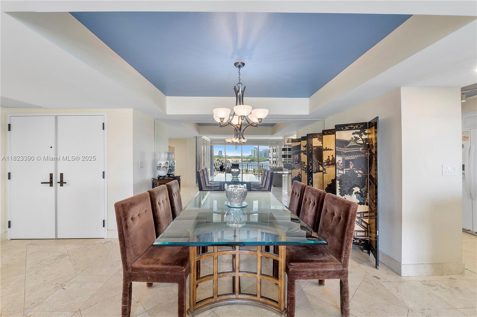 3 Grove Isle Drive, Unit C706 Miami, FL 33133 - Photo 13 of 20 a view of a dining room with furniture window and wooden floor