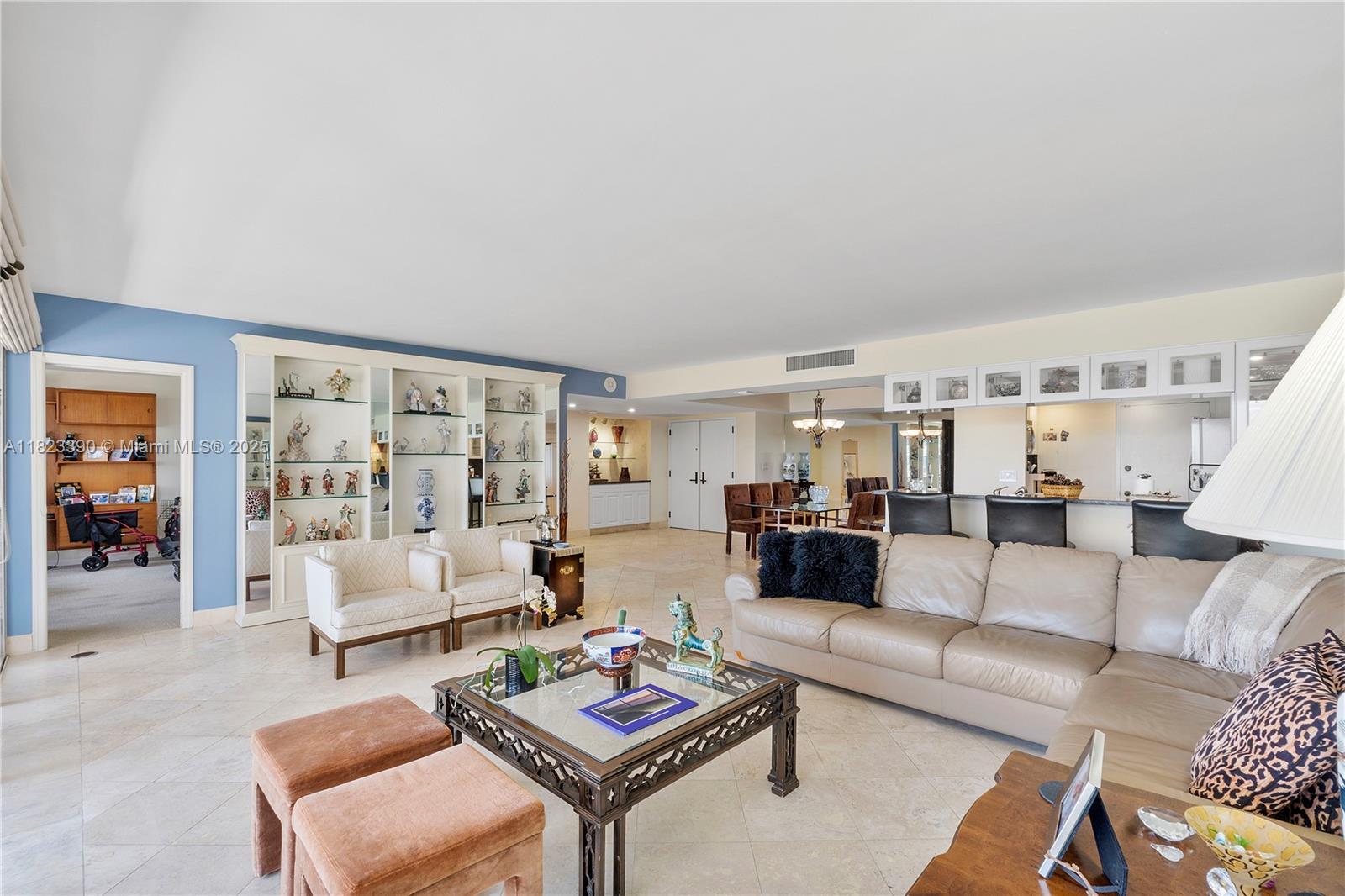 3 Grove Isle Drive, Unit C706 Miami, FL 33133 - Photo 6 of 20 a living room with furniture and wooden floor