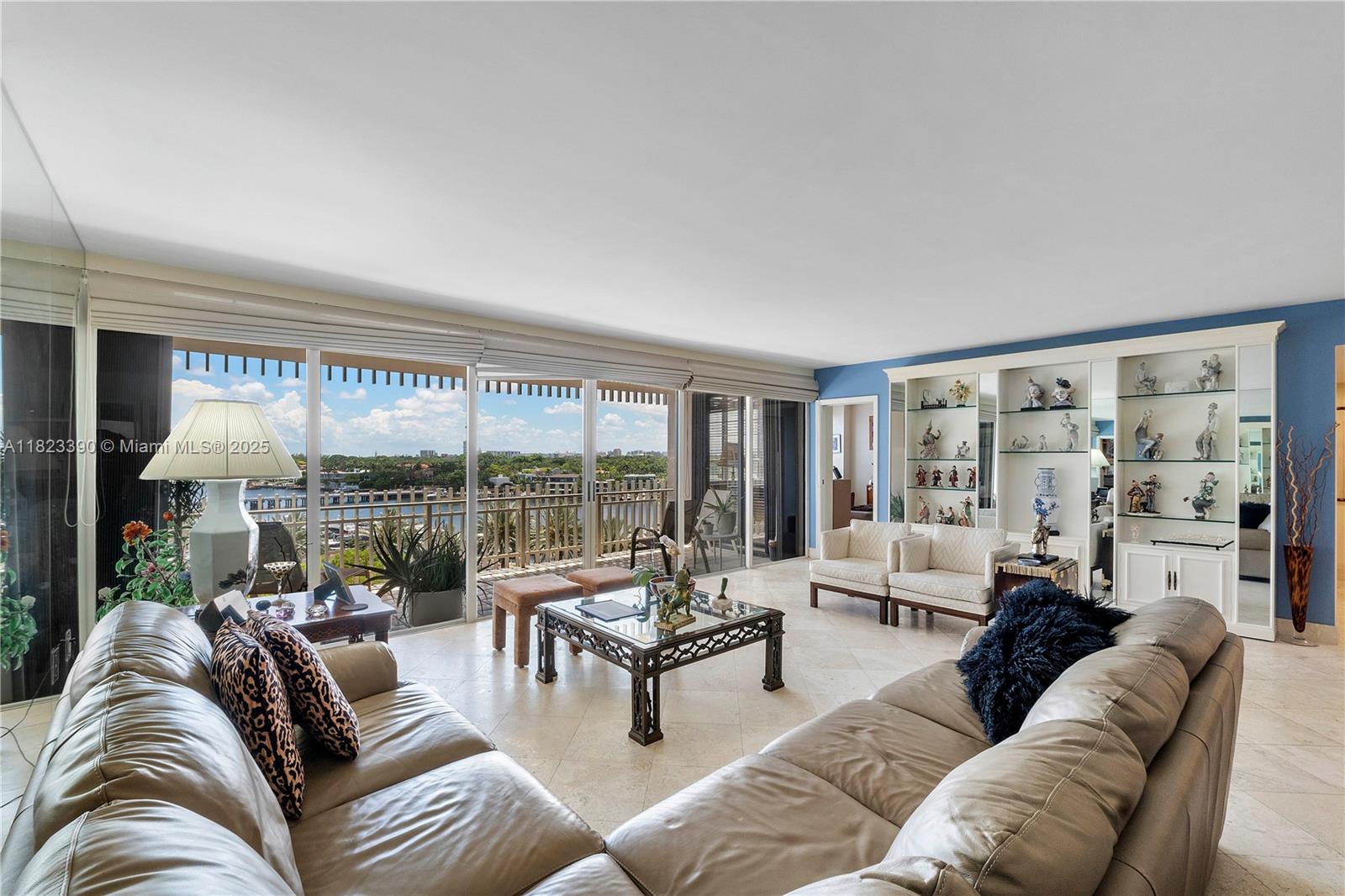 3 Grove Isle Drive, Unit C706 Miami, FL 33133 - Photo 8 of 20 a living room with furniture and a large window