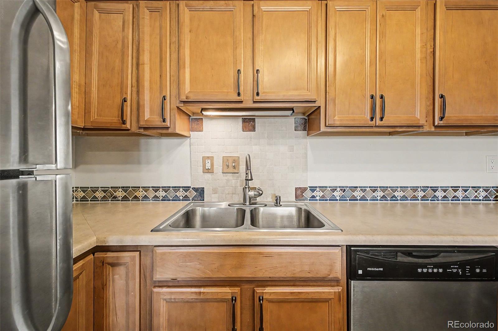 31270 John Wallace Road, Unit 412 Evergreen, CO 80439 - Photo 12 of 38 a kitchen with a sink and cabinets