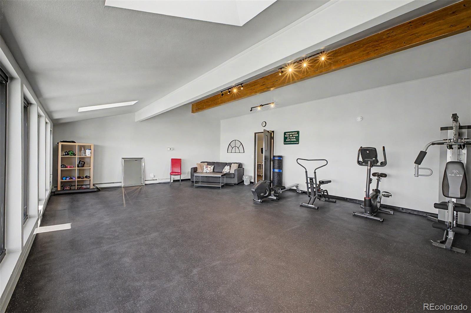 31270 John Wallace Road, Unit 412 Evergreen, CO 80439 - Photo 27 of 38 a view of a livingroom with gym equipment