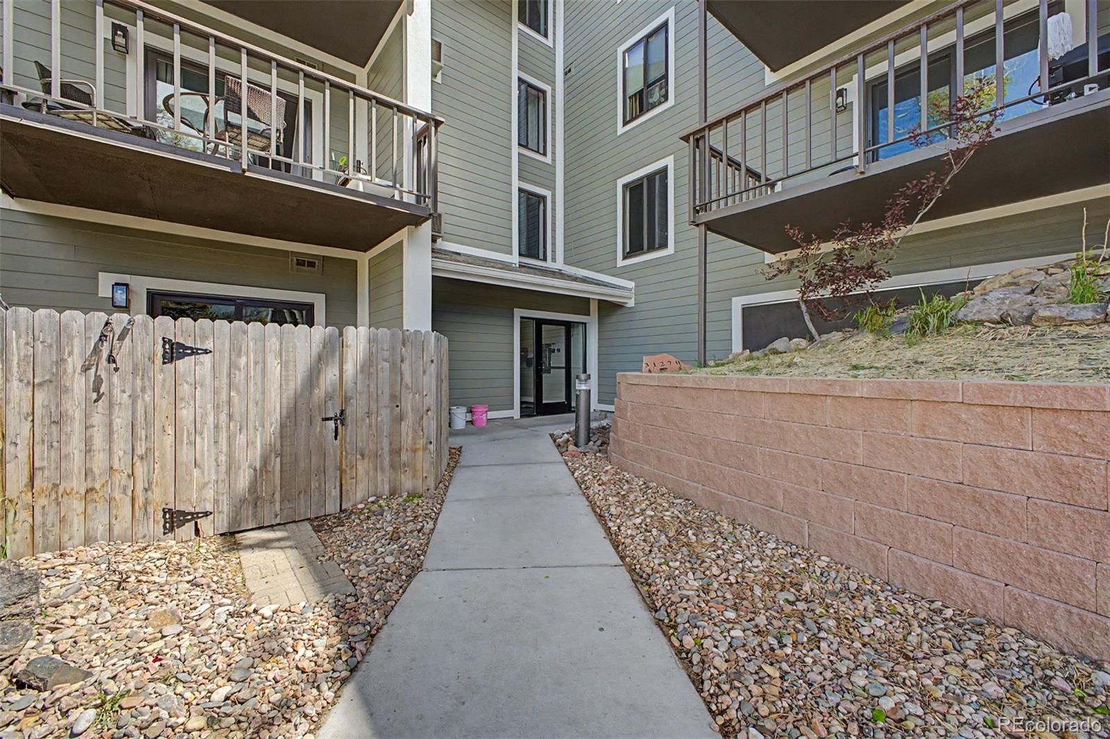 31270 John Wallace Road, Unit 412 Evergreen, CO 80439 - Photo 3 of 38 a front view of a house with a balcony