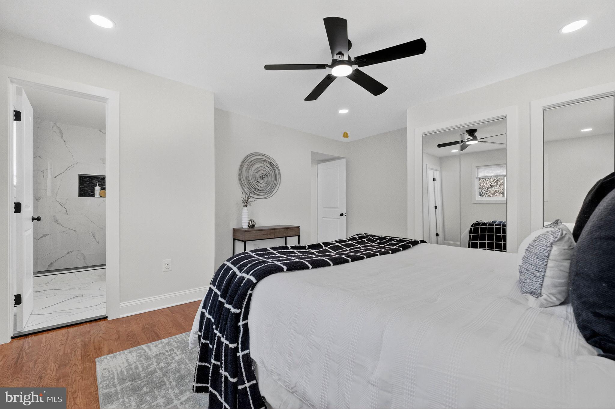 3240 Pope Street Southeast Washington, DC 20020 - Photo 15 of 38 a bedroom with a bed and a chandelier