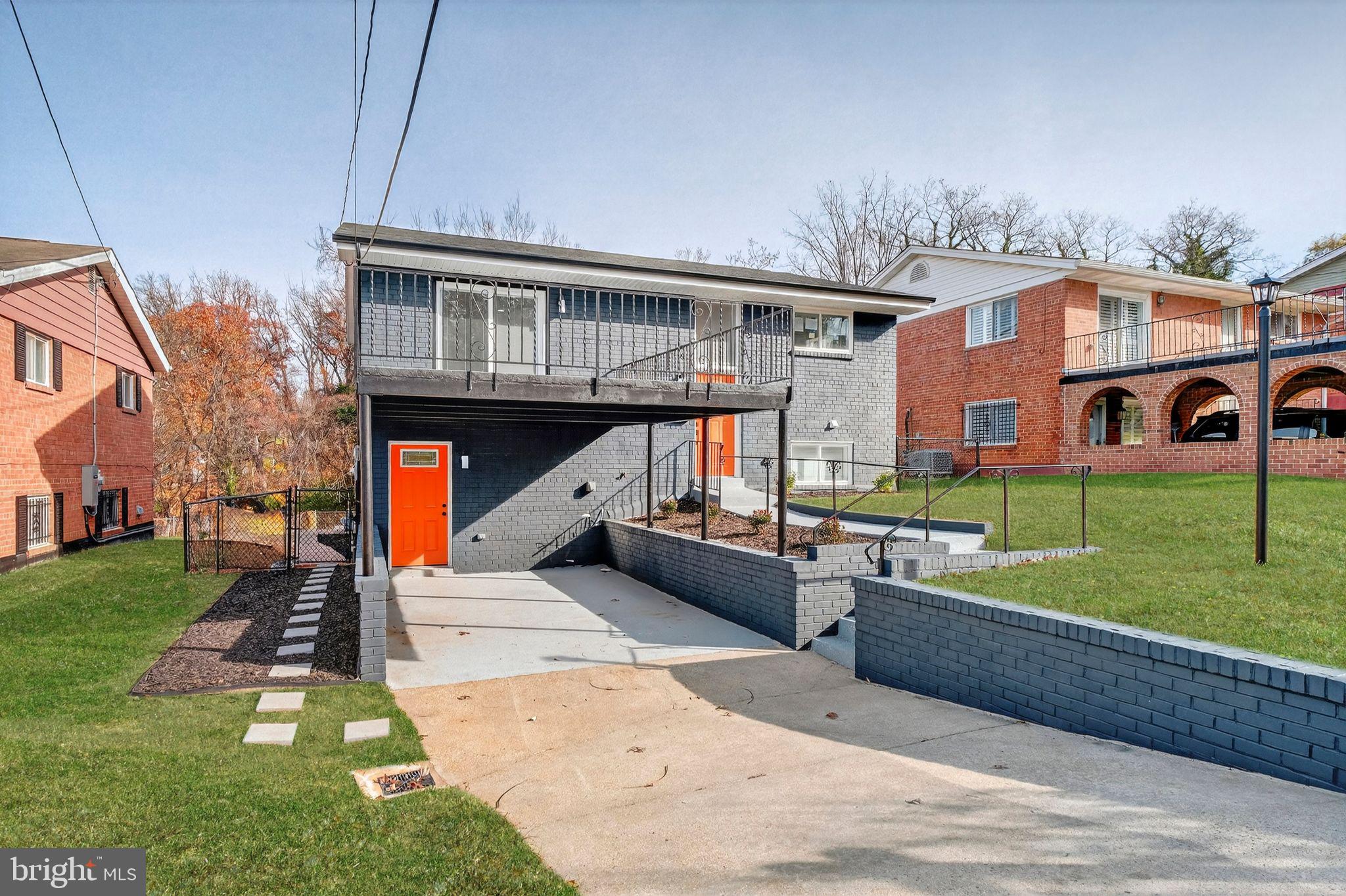 3240 Pope Street Southeast Washington, DC 20020 - Photo 2 of 38 a front view of house with yard