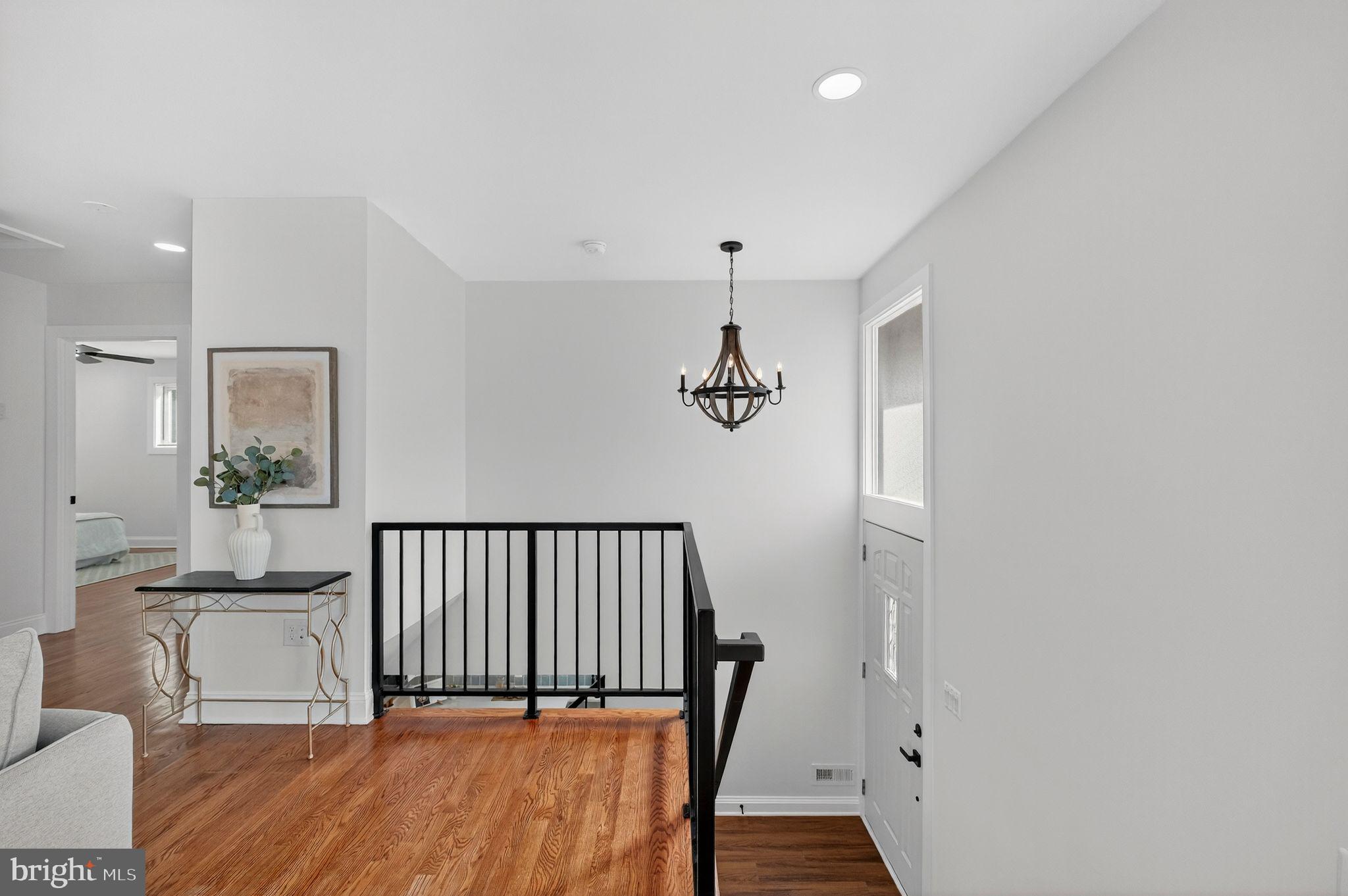 3240 Pope Street Southeast Washington, DC 20020 - Photo 25 of 38 a view of a hallway with wooden floor and a bathroom
