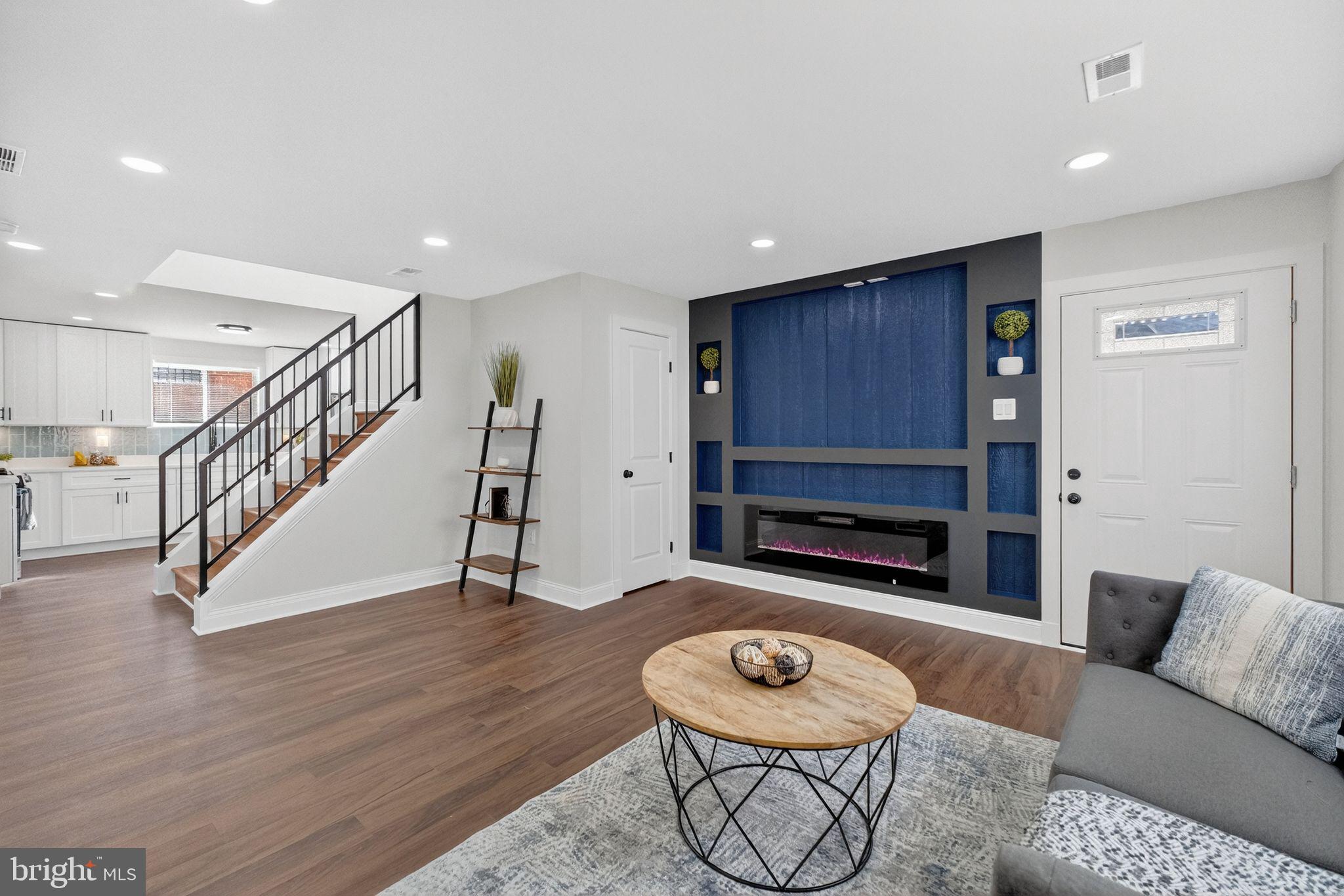 3240 Pope Street Southeast Washington, DC 20020 - Photo 27 of 38 a living room with furniture and a wooden floor