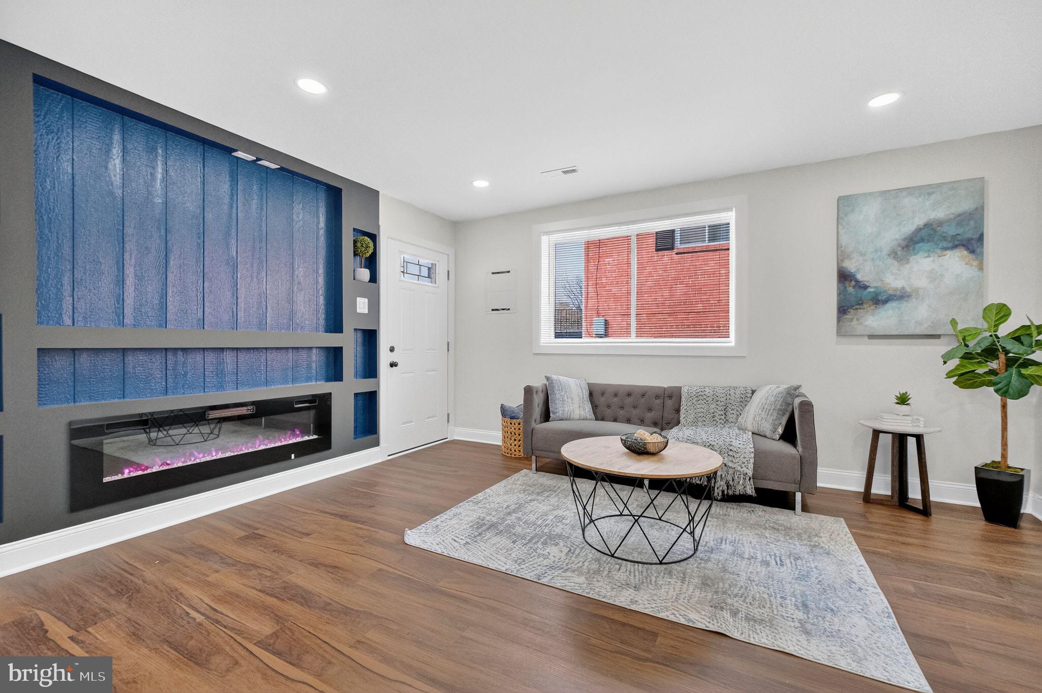 3240 Pope Street Southeast Washington, DC 20020 - Photo 29 of 38 a living room with furniture and a fireplace