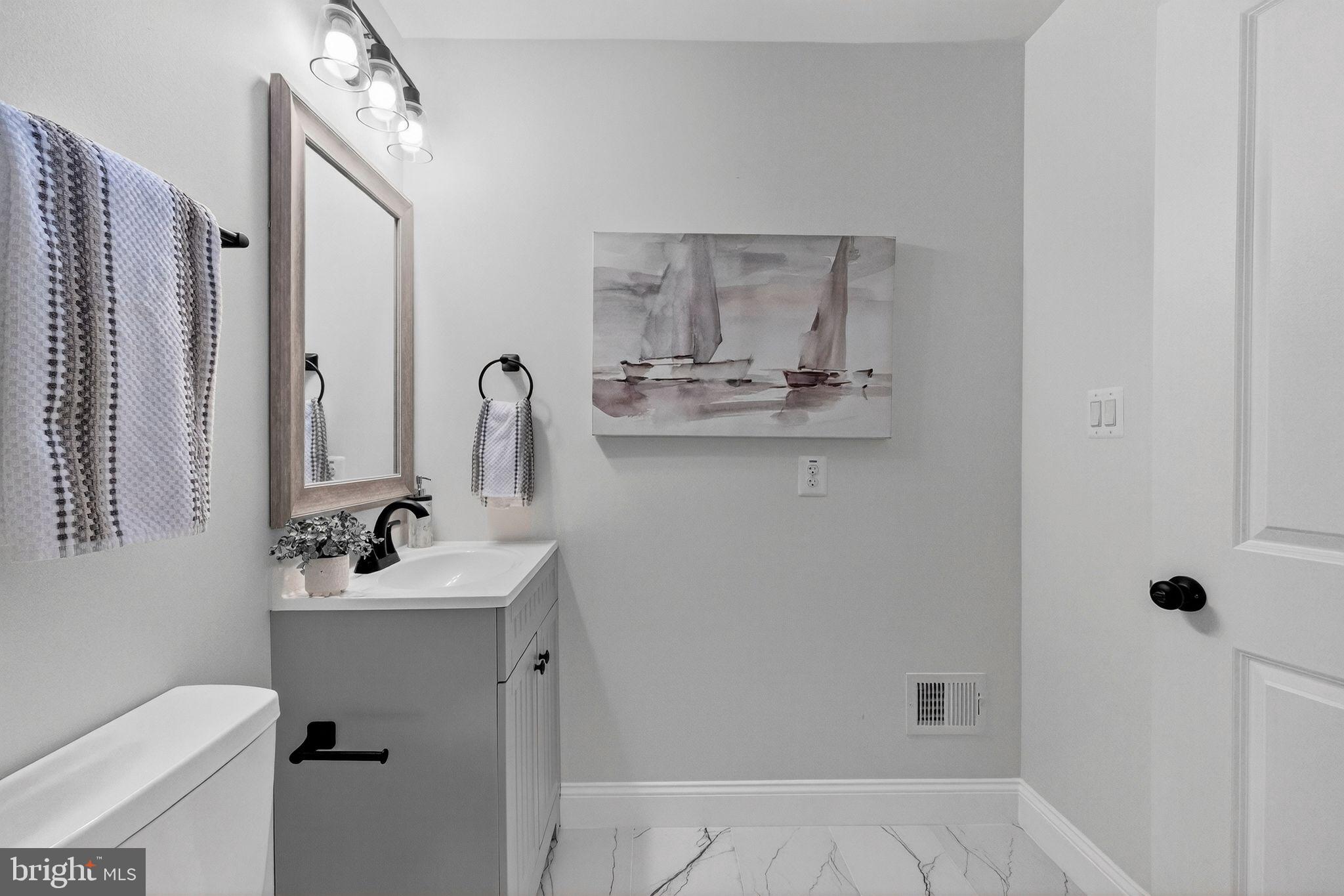 3240 Pope Street Southeast Washington, DC 20020 - Photo 34 of 40 a bathroom with a sink toilet and shower