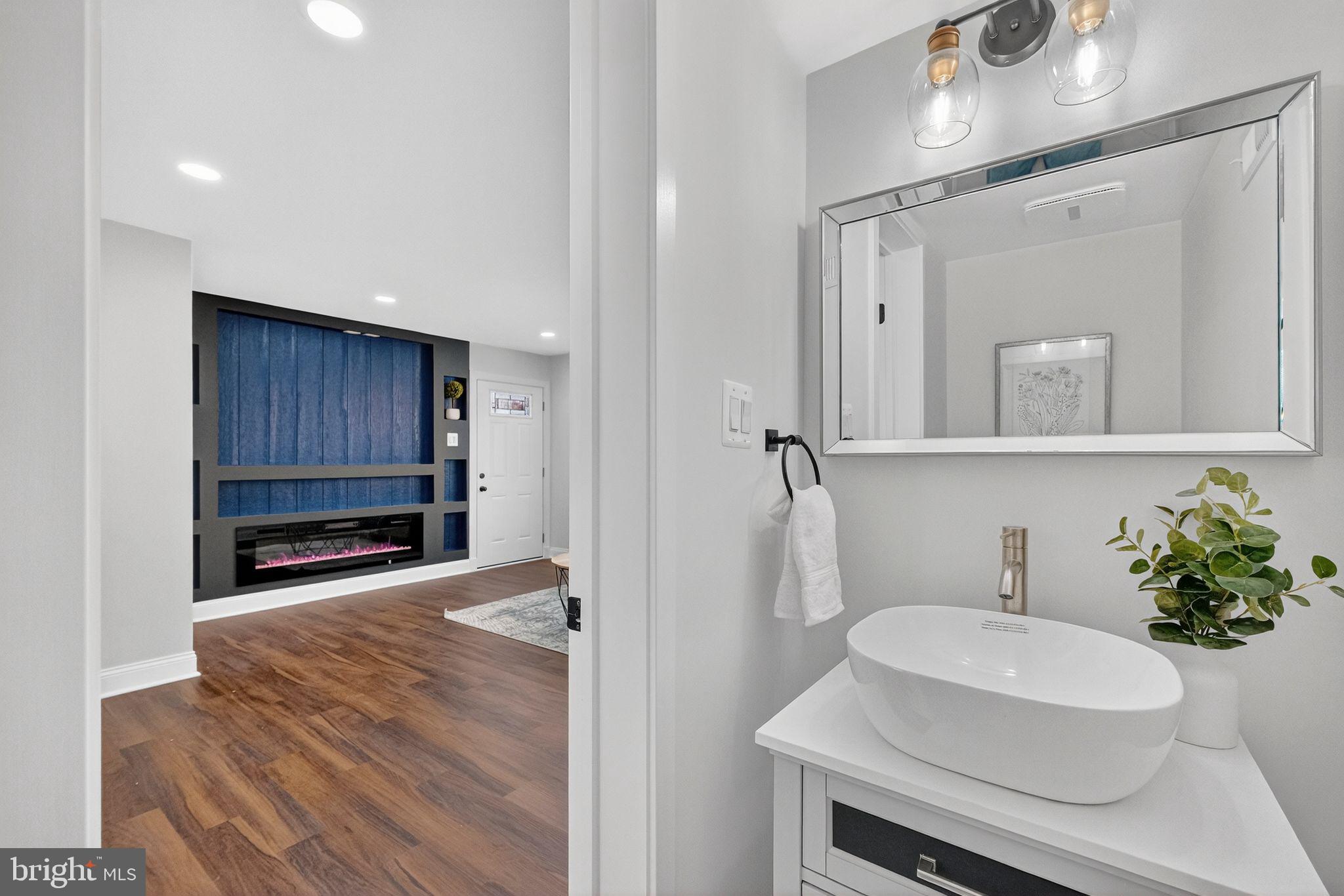 3240 Pope Street Southeast Washington, DC 20020 - Photo 34 of 38 a bathroom with a sink a toilet and a mirror