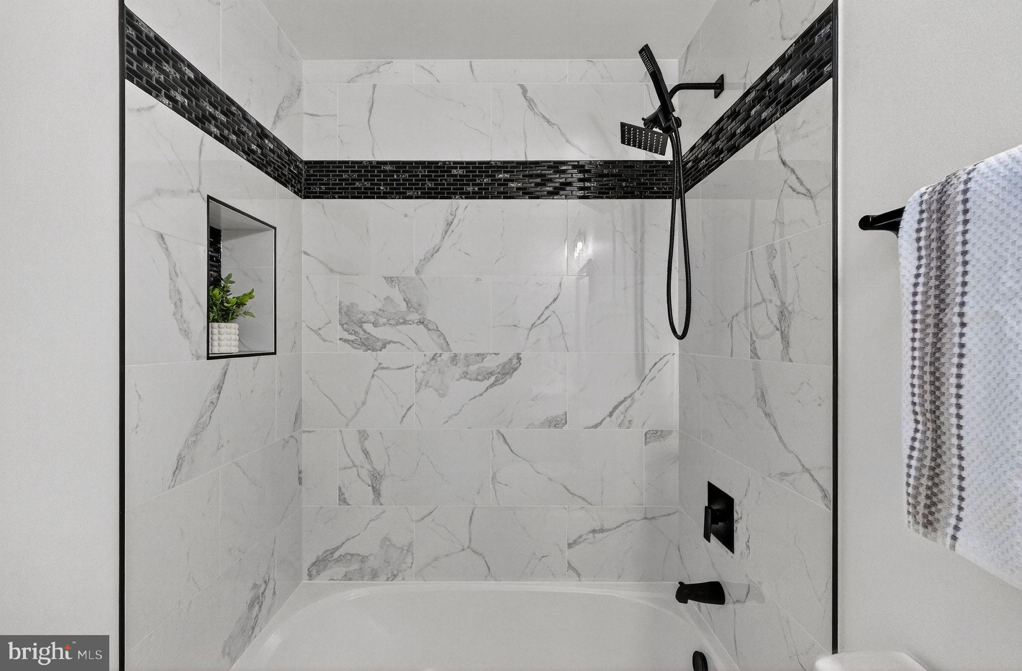 3240 Pope Street Southeast Washington, DC 20020 - Photo 35 of 40 a bathroom with a bathtub and shower