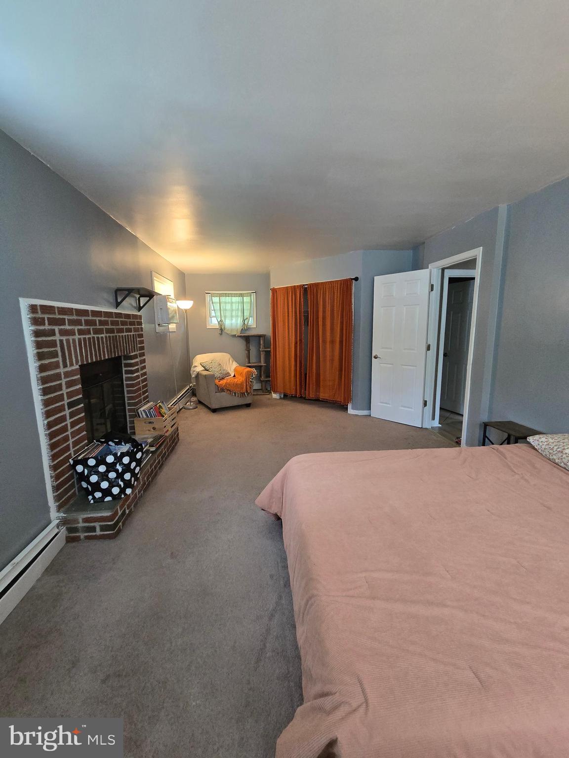 1492 Faulkland Road Wilmington, DE 19805 - Photo 11 of 23 a bed room with furniture and a fireplace