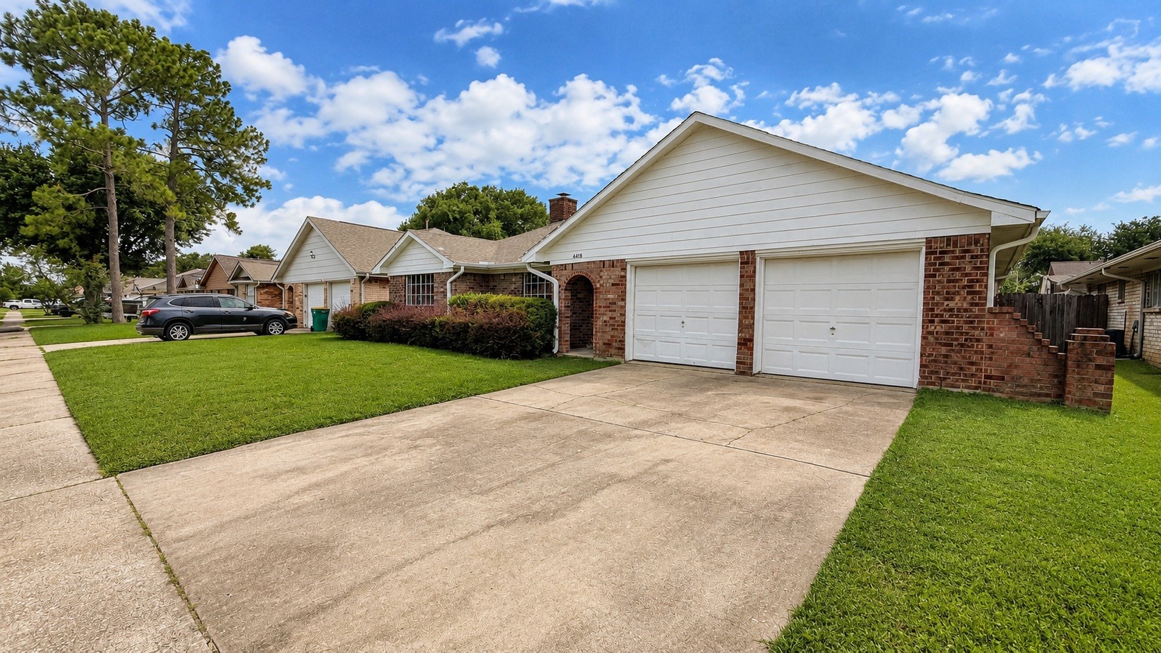 4418 Ponca Street Pasadena, TX 77504 - Photo 2 of 23 A second exterior angle showing the driveway, garage, and everyday approach. (image has been enhance for marketing purposes)