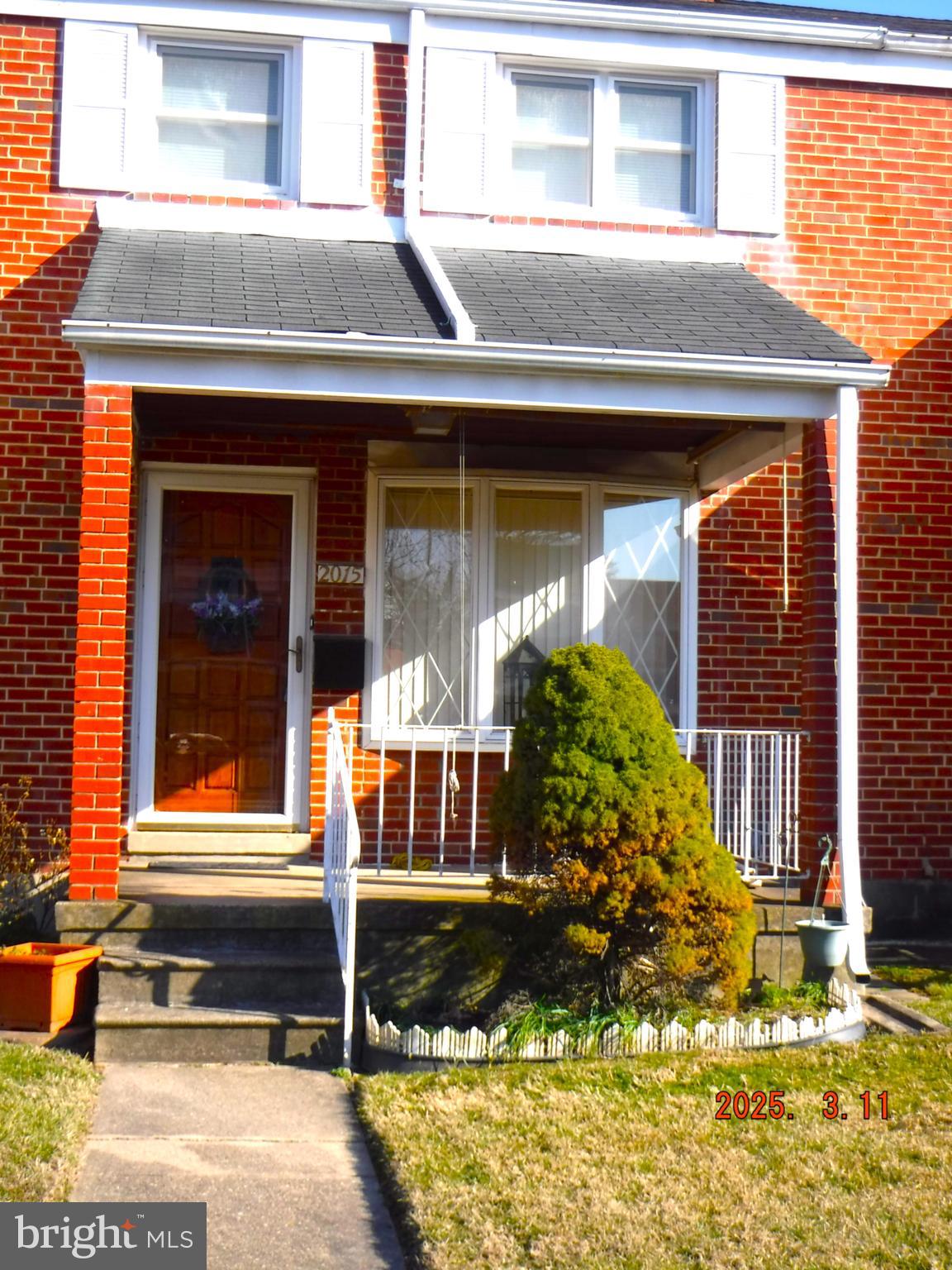 2015 Wareham Road Baltimore, MD 21222 - Photo 2 of 54 a front view of a house with a yard
