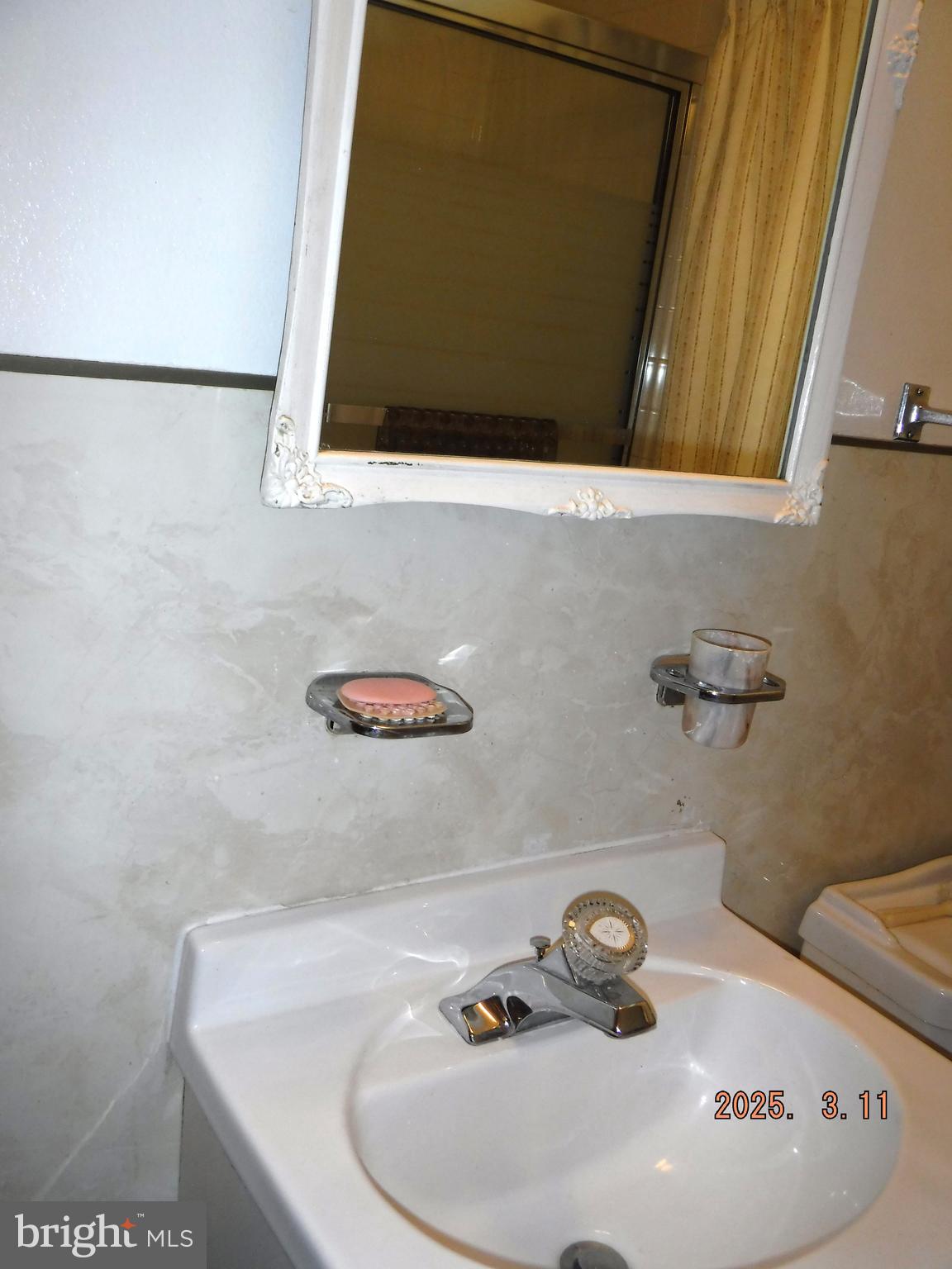 2015 Wareham Road Baltimore, MD 21222 - Photo 29 of 54 a bathroom with a sink and a mirror