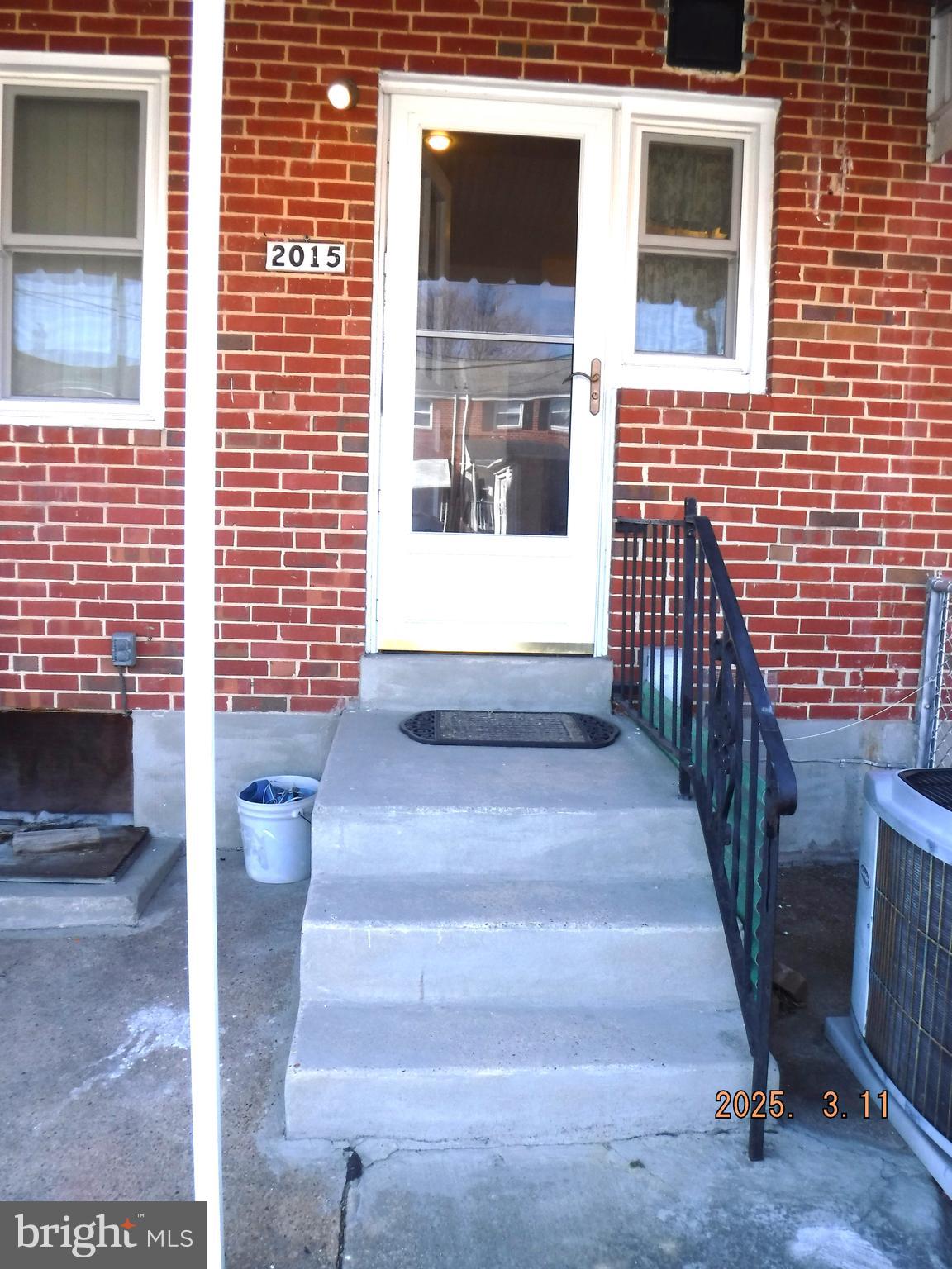 2015 Wareham Road Baltimore, MD 21222 - Photo 53 of 54 a view of front door of house with stairs