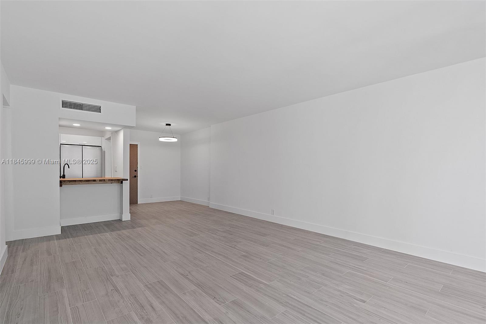 1200 West Avenue, Unit 521 Miami Beach, FL 33139 - Photo 15 of 51 a view of empty room with wooden floor