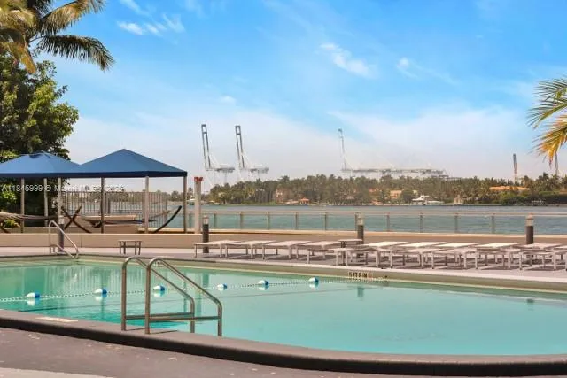 a view of a swimming pool with a lake view