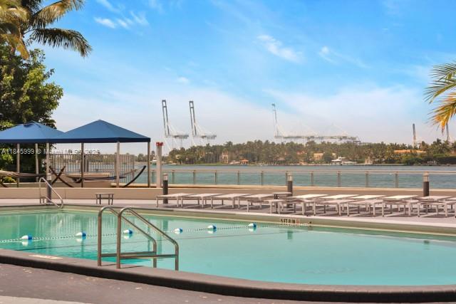 1200 West Avenue, Unit 521 Miami Beach, FL 33139 - Photo 22 of 51 a view of a swimming pool with a lake view