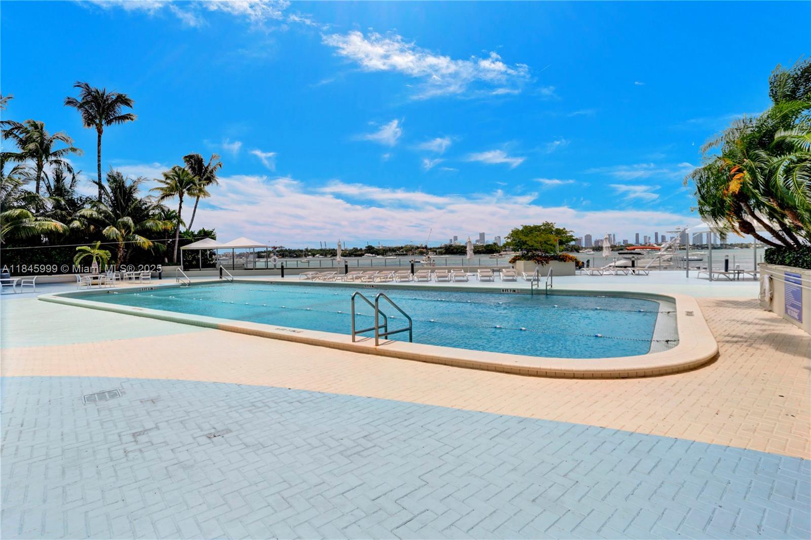 1200 West Avenue, Unit 521 Miami Beach, FL 33139 - Photo 24 of 51 a view of a house with a swimming pool and a yard