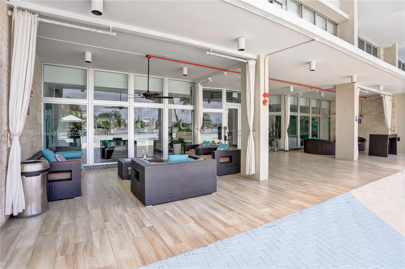 1200 West Avenue, Unit 521 Miami Beach, FL 33139 - Photo 41 of 51 a view of a living room kitchen with furniture and wooden floor