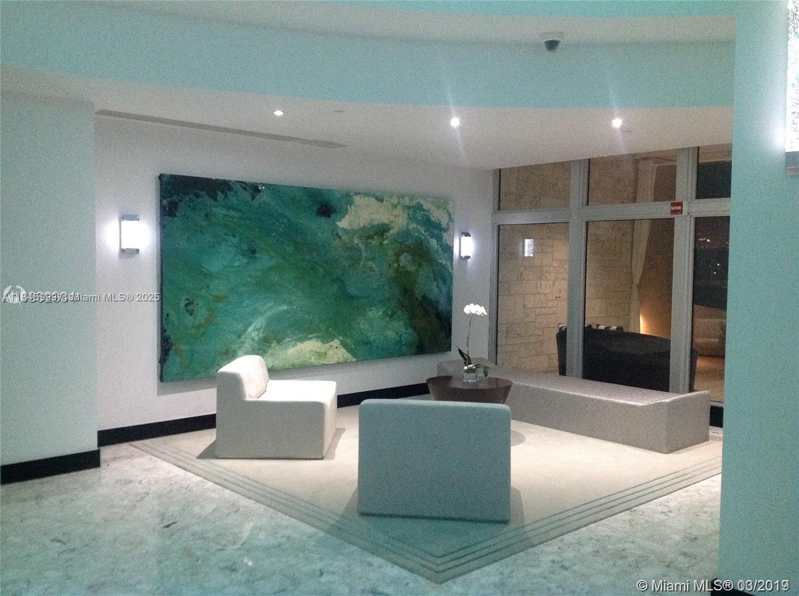 1200 West Avenue, Unit 521 Miami Beach, FL 33139 - Photo 48 of 51 a living room with furniture and a large window