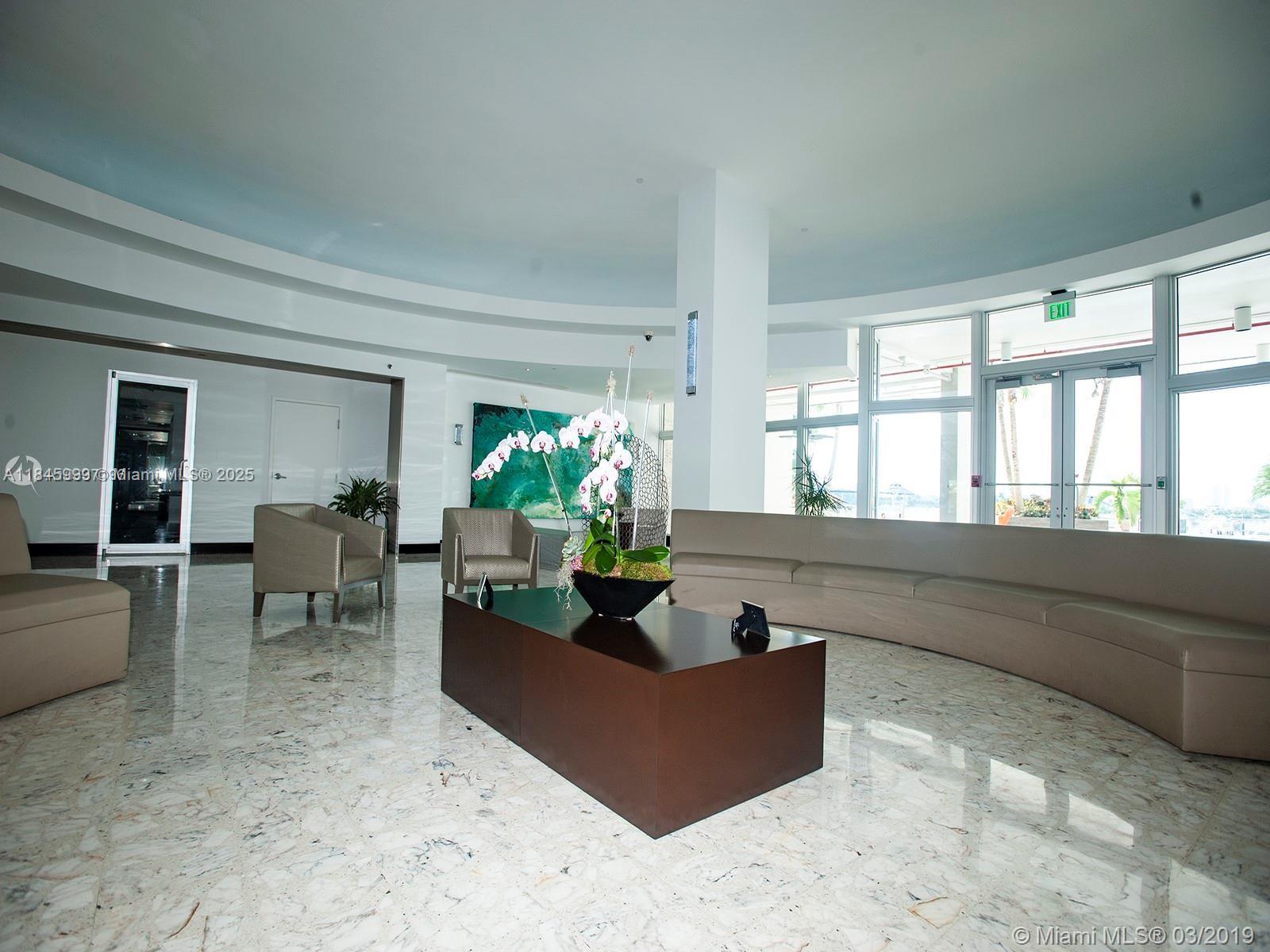 1200 West Avenue, Unit 521 Miami Beach, FL 33139 - Photo 49 of 51 a living room with furniture and a potted plant