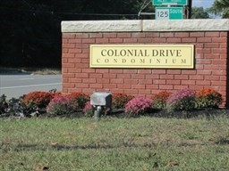 40 Colonial Drive, Unit 8 Andover, MA 01810 - Photo 1 of 19 a signage on a brick wall