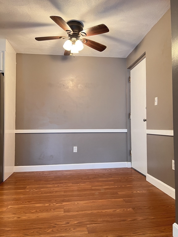 40 Colonial Drive, Unit 8 Andover, MA 01810 - Photo 11 of 19 a view of a room with a ceiling fan and wooden floor