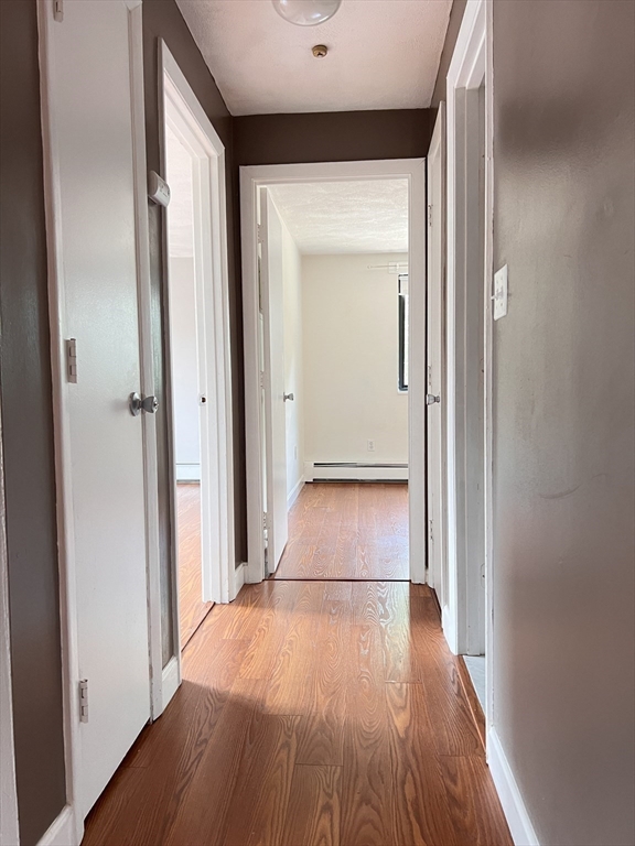 40 Colonial Drive, Unit 8 Andover, MA 01810 - Photo 12 of 19 a view of a hallway with wooden floor