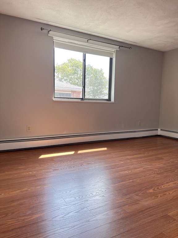 40 Colonial Drive, Unit 8 Andover, MA 01810 - Photo 15 of 19 a view of a room with wooden floor and a window